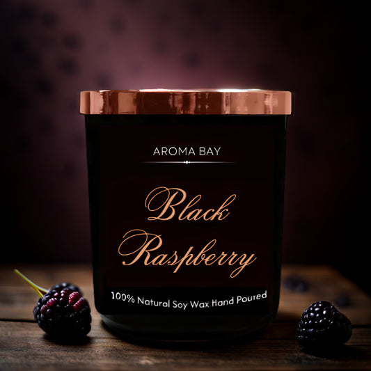 Luxury black raspberry and vanilla scented candle in a black glass container with gold lid.