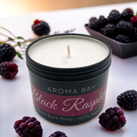 Luxury black raspberry and vanilla soy scented candle in a black travel tin container.