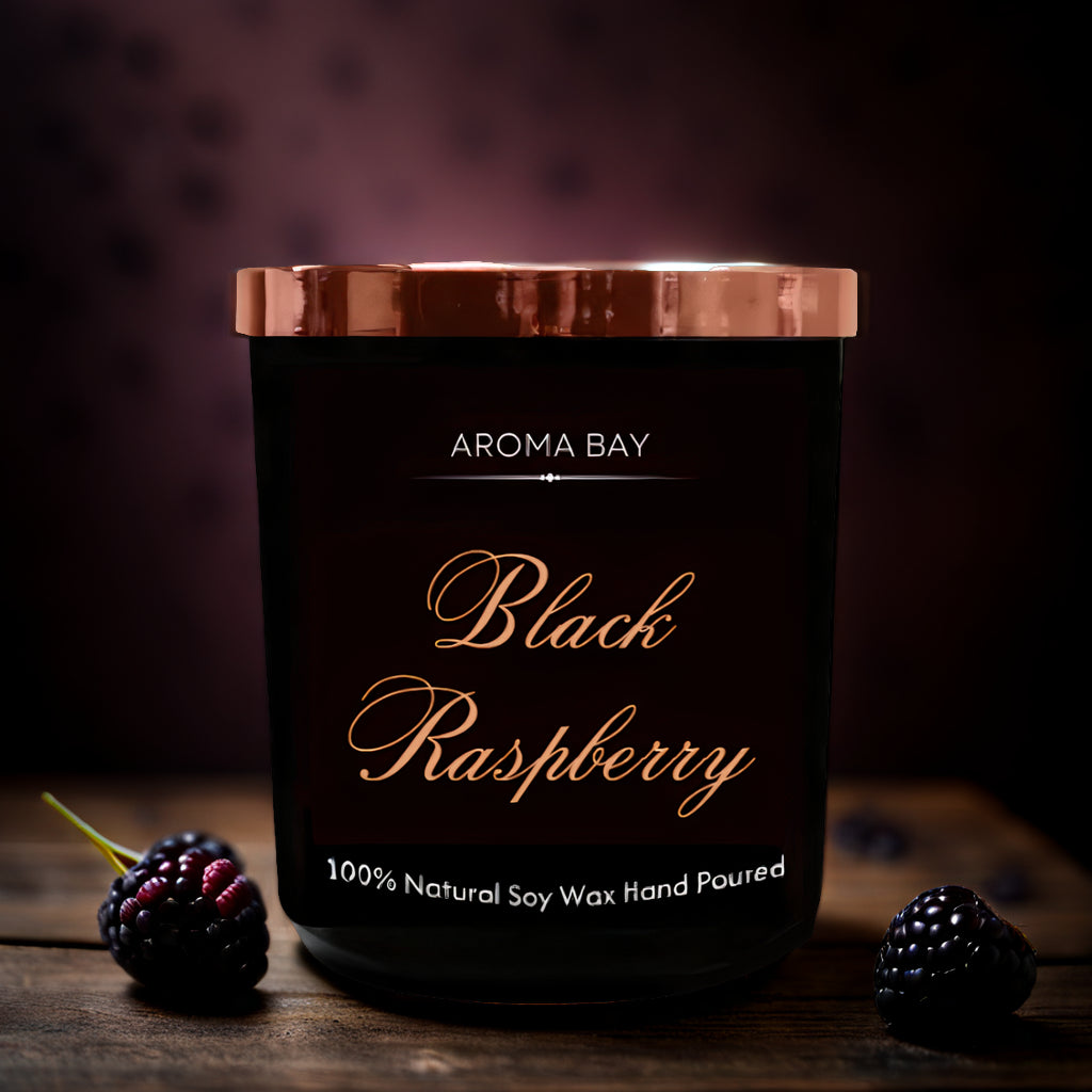 Luxury black raspberry and vanilla scented candle in a black glass container with gold lid. 