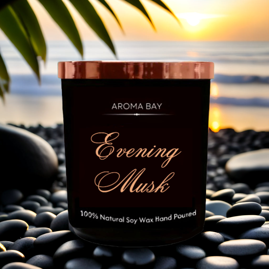 Luxury Musk scented soy candle in black glass container with gold lid.