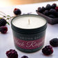 Luxury black raspberry and vanilla soy scented candle in a black travel tin container. 