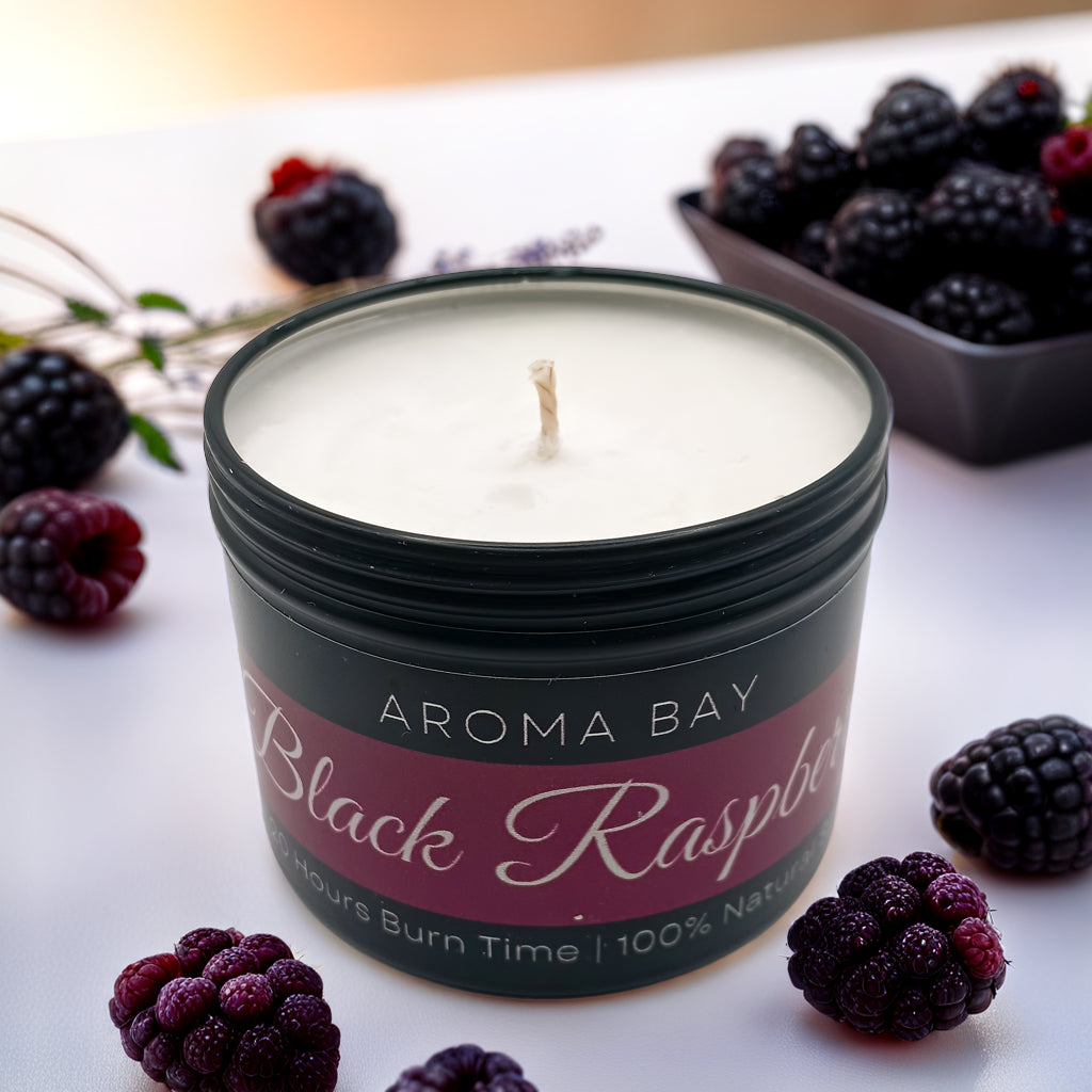 Luxury black raspberry and vanilla soy scented candle in a black travel tin container. 