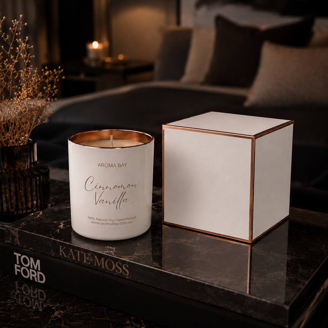 Aroma Bay Candle and its packaging on a marble surface with a blurred background