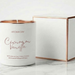 Candle with 'Aroma Bay' branding on a marble surface