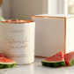 Aroma Bay watermelon lemonade candle with watermelon slices on a marble surface