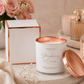 Aroma Bay Strawberry & Cream candle with rose gold lid and packaging on a neutral background.